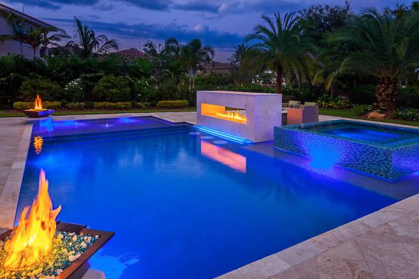 nighttime view of custom luxury pool